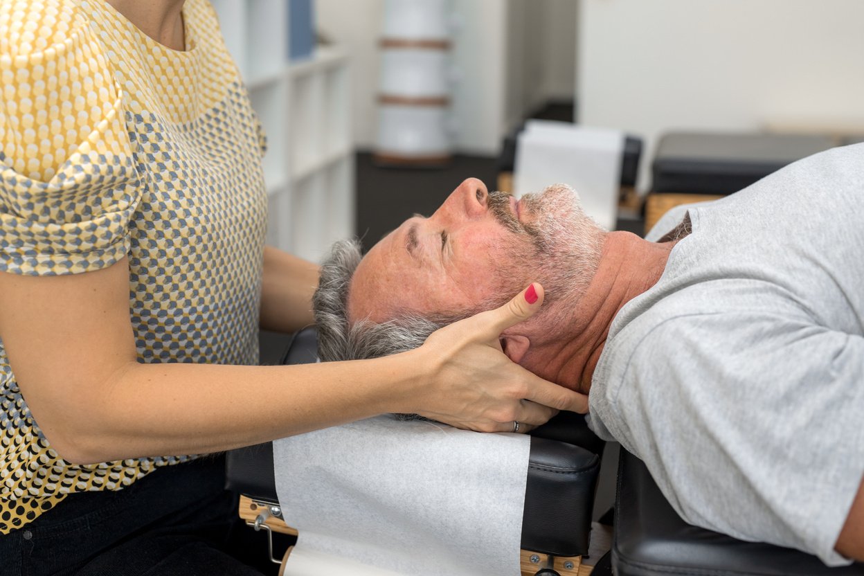 Senior Man Having Chiropractic Adjustment